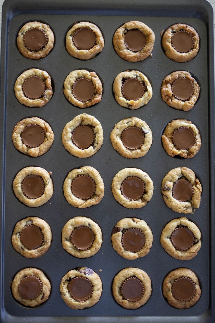 chocolate covered cookies on a cookie sheet ready to go into the oven for desserts