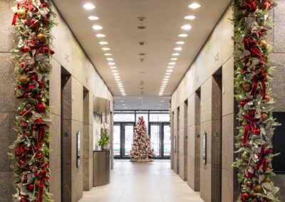 the hallway is decorated with christmas decorations and garlands on either side of the doors