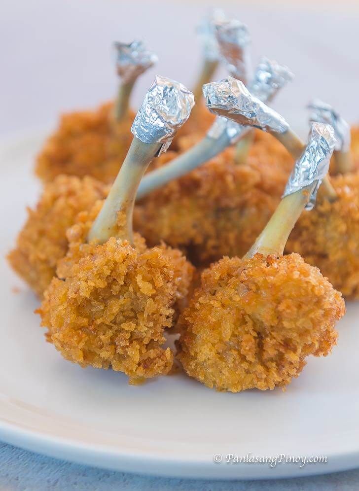 small pieces of food sitting on top of a white plate