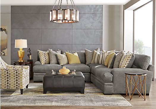 a living room with gray couches and yellow pillows on the sofa is featured in an ad for sectional furniture