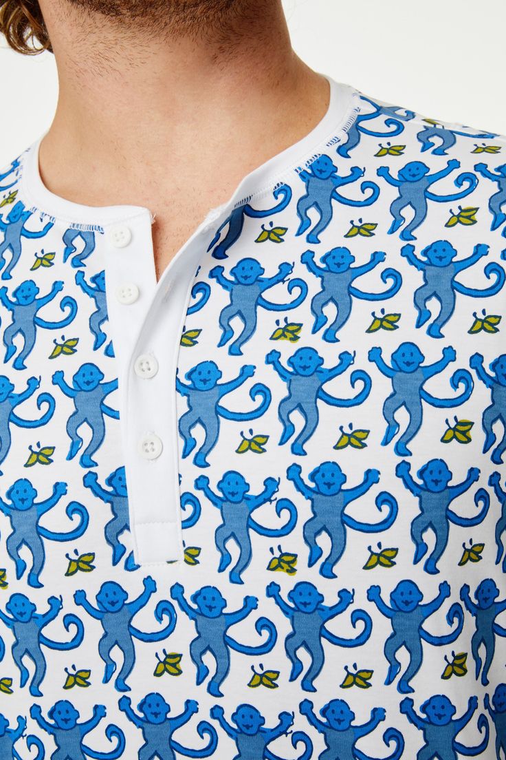 Make sure the man in your life enjoys bedtime coziness with this ultra-soft pajama set that includes a long-sleeve top and matching drawstring bottoms featuring a playful monkey print. 4 Button Henley Drawstring Waist Pockets Super-Smooth Flatlock Seams Materials and Care 100% Long-Staple Premium Cotton Machine wash warm with like colors. Do not bleach Line Dry is recommended. Warm iron if needed Imported Prewashed Measurement Information Tom is 6'1" and wears size M Size M Top Length: 29.5" (fr Monkey Print, Roller Rabbit, Soft Pajamas, Sleepwear & Loungewear, Shipping Orders, Classic Pattern, Drawstring Waist, Pajama Set, The Man