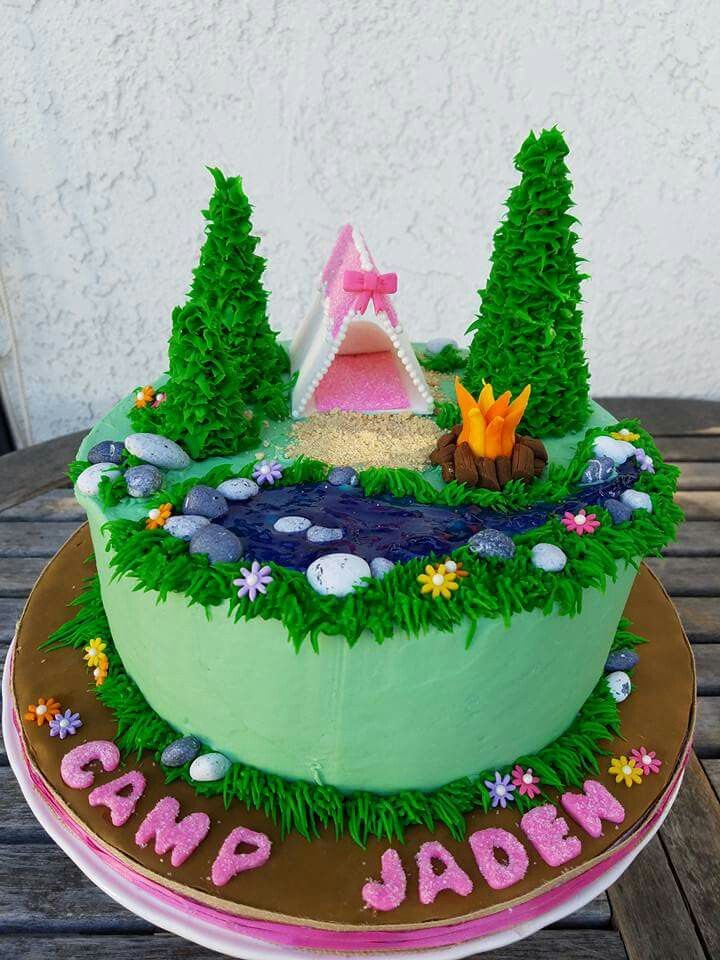 a cake with grass and trees on it