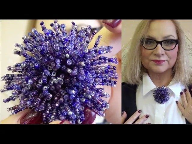 a woman wearing glasses is holding a purple ballonniert in front of her face