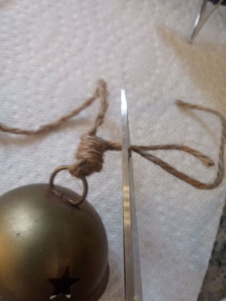 a pair of scissors sitting next to an ornament