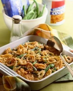 a casserole dish filled with pasta and green beans