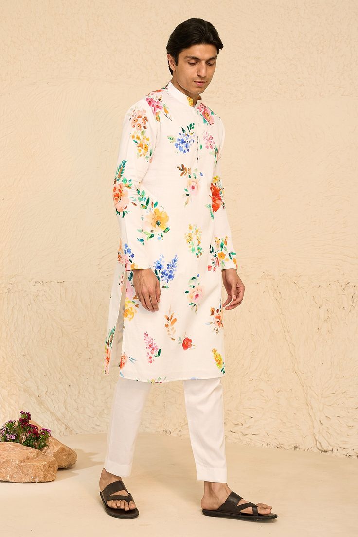 White full sleeve all over tropical floral print kurta. Paired with white pant
Components: 2
Pattern: Print
Type Of Work: Floral
Neckline: Stand Collar
Sleeve Type: Full Sleeves
Fabric: Cotton Satin
Color: White
Other Details: 
Half button closure
Occasion: Sangeet - Aza Fashions White Pant, Tropical Floral Print, Kurta With Pants, Satin Color, Full Sleeves, Tropical Floral, White Pants, Aza Fashion, Full Sleeve