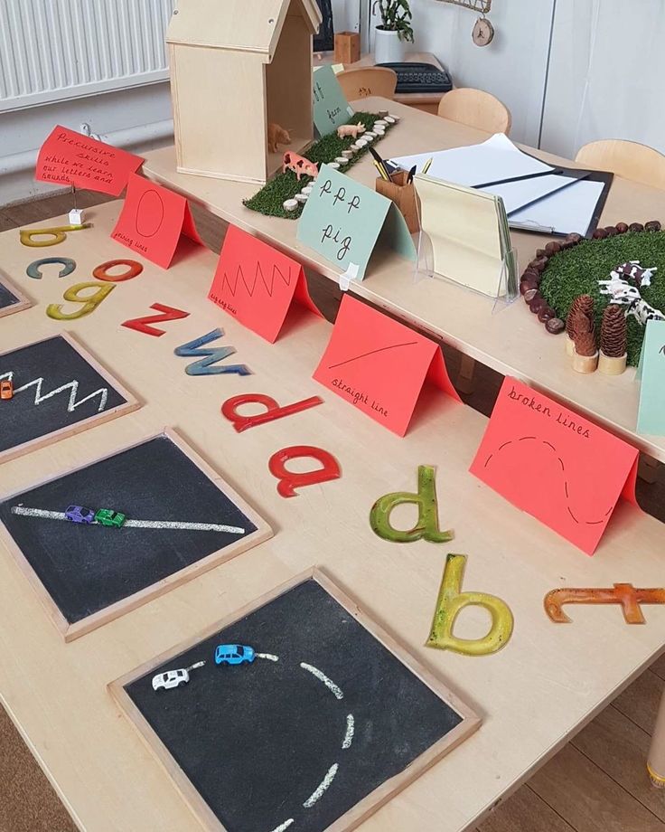 a table topped with lots of different types of letters and numbers on top of it