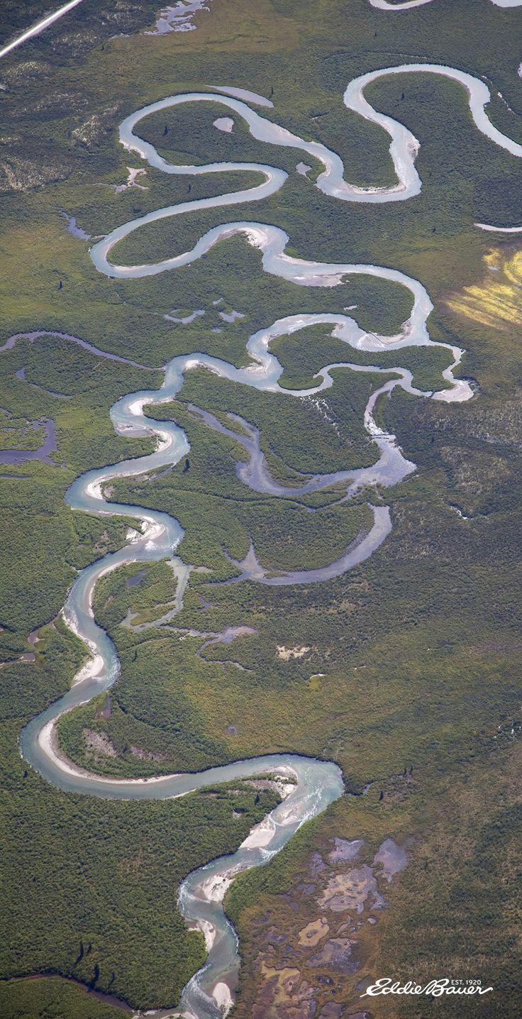 an aerial view of the water and land in this area, including rivers running through them