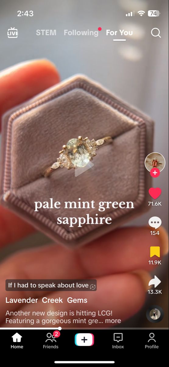 someone holding a ring in their hand with the words pale mint green sapphire on it