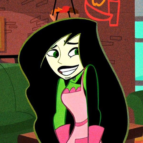 an animated image of a woman with long black hair and pink dress in a living room