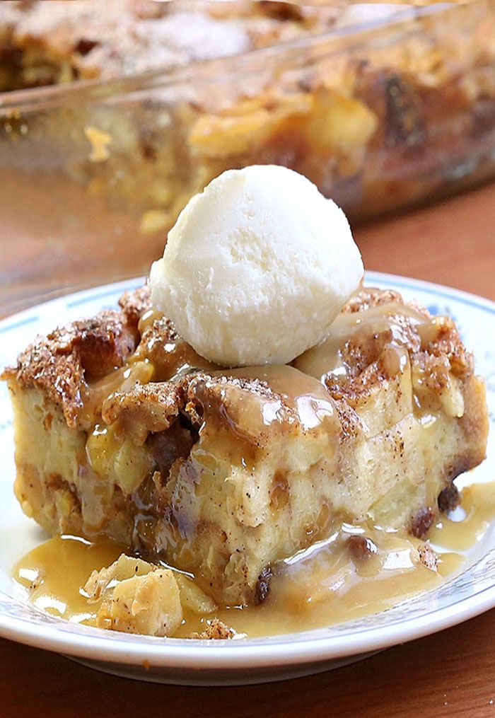 a piece of pie with ice cream on top sitting on a plate next to a casserole dish