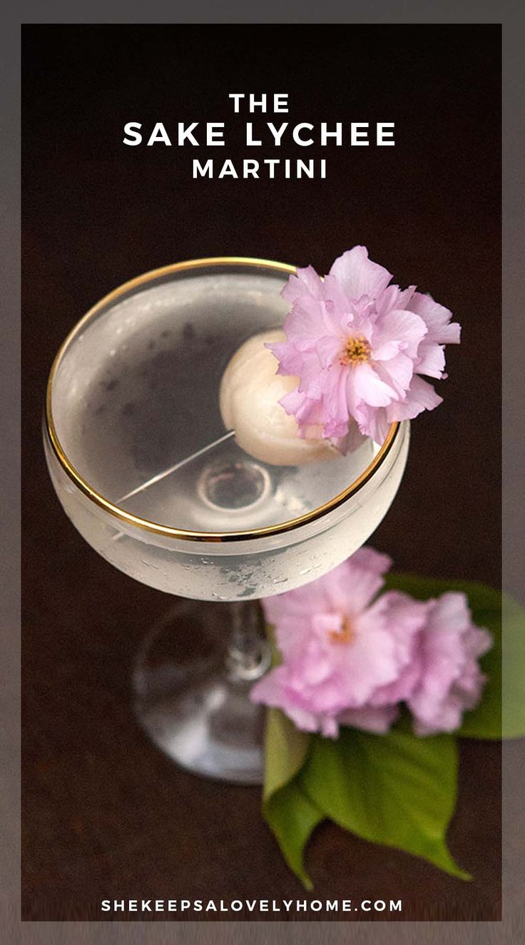 a close up of a drink with flowers in it