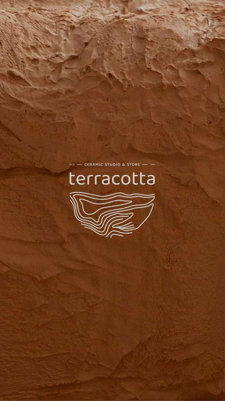 the terracotta logo is shown on a brown background