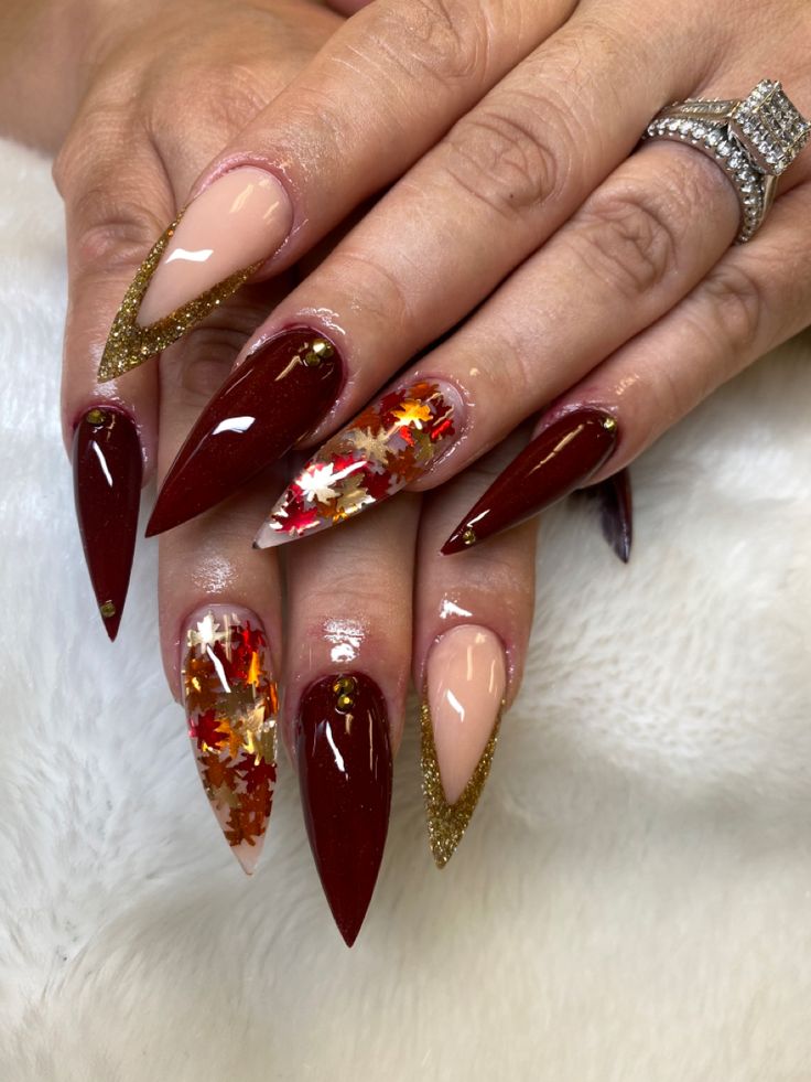 Red Nails With Leaves, Thanksgiving Stilleto Nails, September Almond Nails Designs, Encapsulated Nails Fall, Maroon Thanksgiving Nails, Fall Stellio Nails, Thanksgiving Nail Inspo Almond, Fall Wedding Nails For Bride Burnt Orange, November Stiletto Nails