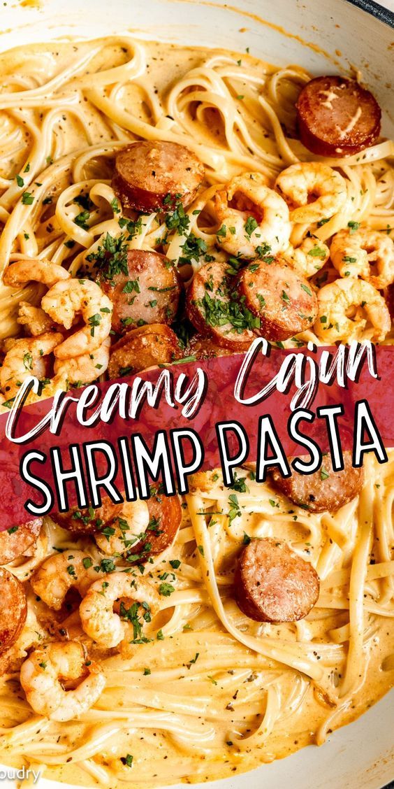 creamy cajun shrimp pasta in a skillet with sausage and parmesan cheese