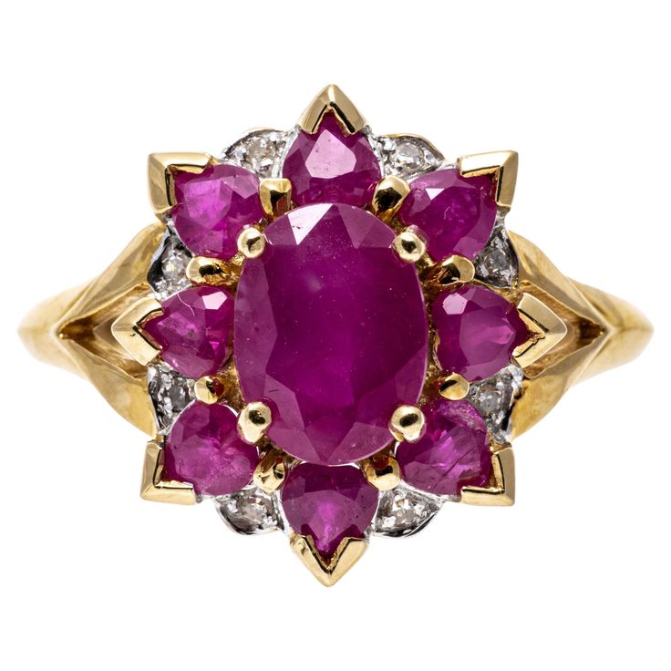 14k yellow gold ring. 14k yellow gold striking cluster ring, set with a center oval faceted, opaque pinkish red color ruby, approximately 0.94 TCW. Surrounding the center is a halo of heart faceted, opaque reddish pink color rubies, approximately 0.64 TCW, and highlighted with round faceted diamonds, approximately 0.02 TCW. The ring is finished with split shoulders, and all of the stones are prong set. Marks: 14k Dimensions: 9/16" across the top x 5/8" wide Weight: 3.3 gross dwt Cluster Ring Set, Pinkish Red, Lorde, Yellow Gold Ring, Color Rosa, Cluster Ring, Yellow Gold Rings, Ring Set, Prong Setting