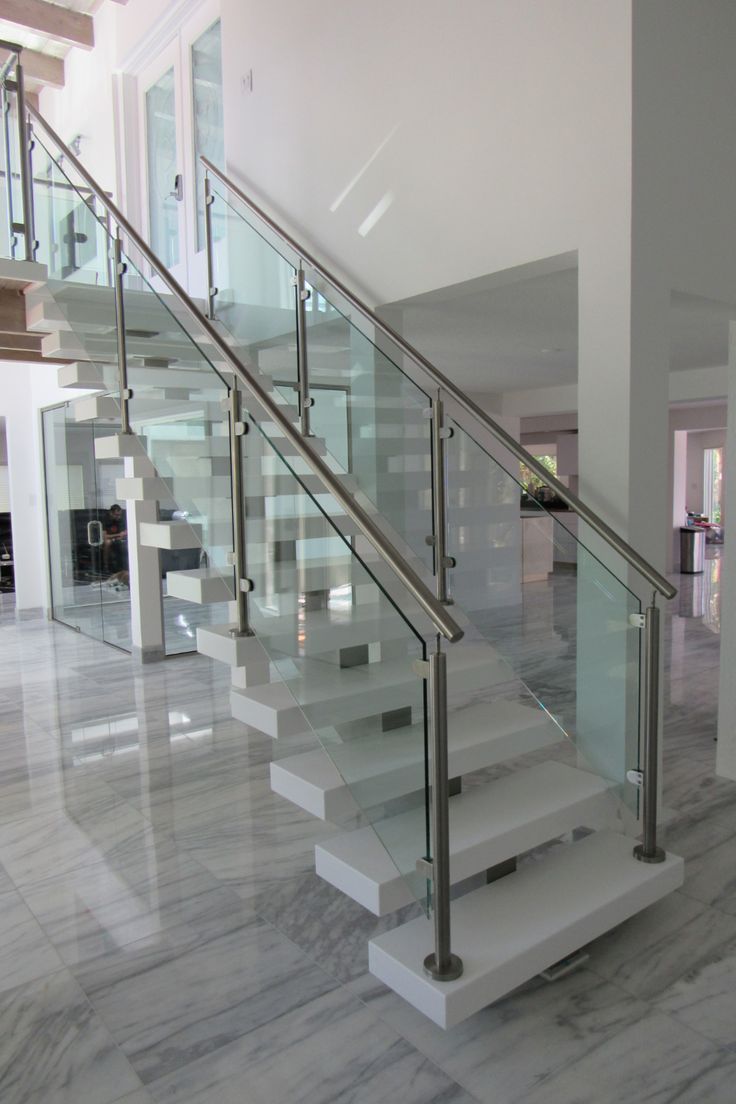 the stairs are made of glass and steel