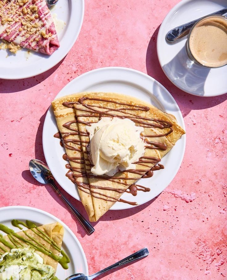 three plates with different types of desserts and drinks on pink table top, including ice cream