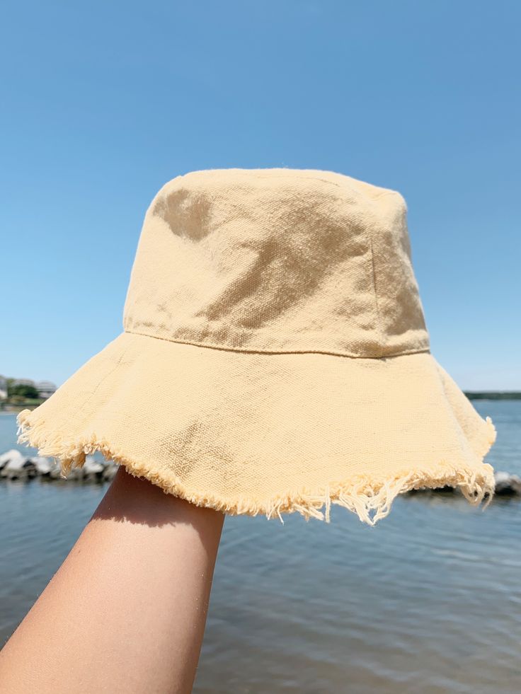 Beige, blue, and yellow. Blue Bucket Hat For Summer, Casual Yellow Cotton Bucket Hat, Yellow Cotton Summer Bucket Hat, Yellow Summer Cotton Bucket Hat, Summer Bucket Sun Hat For Spring, Trendy Yellow Hats For Spring, Casual Yellow Hat For Spring, Trendy Yellow Sun Hat For Spring, Yellow Cotton Hat For Spring