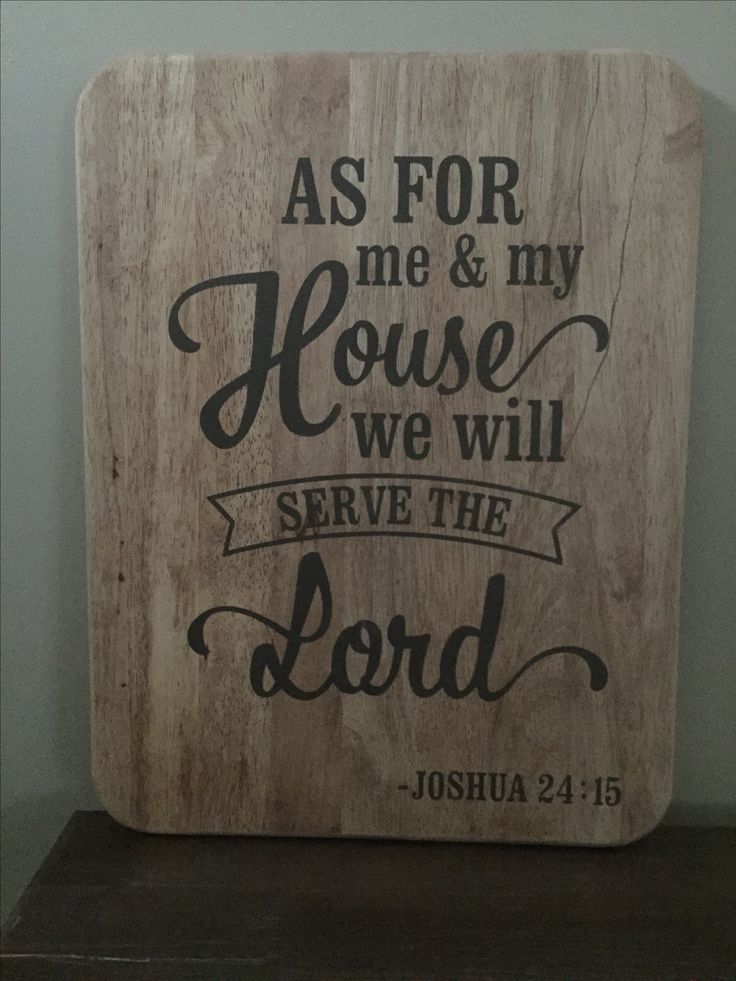 a wooden sign that says as for me and my house we will serve the lord