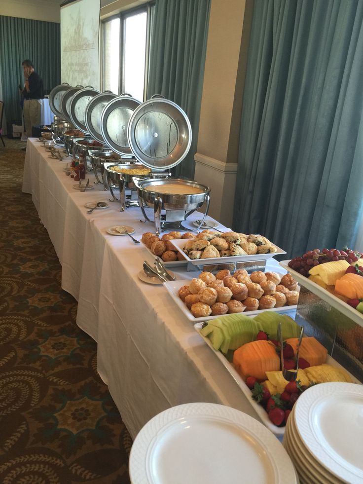 a long table with many plates and food on it