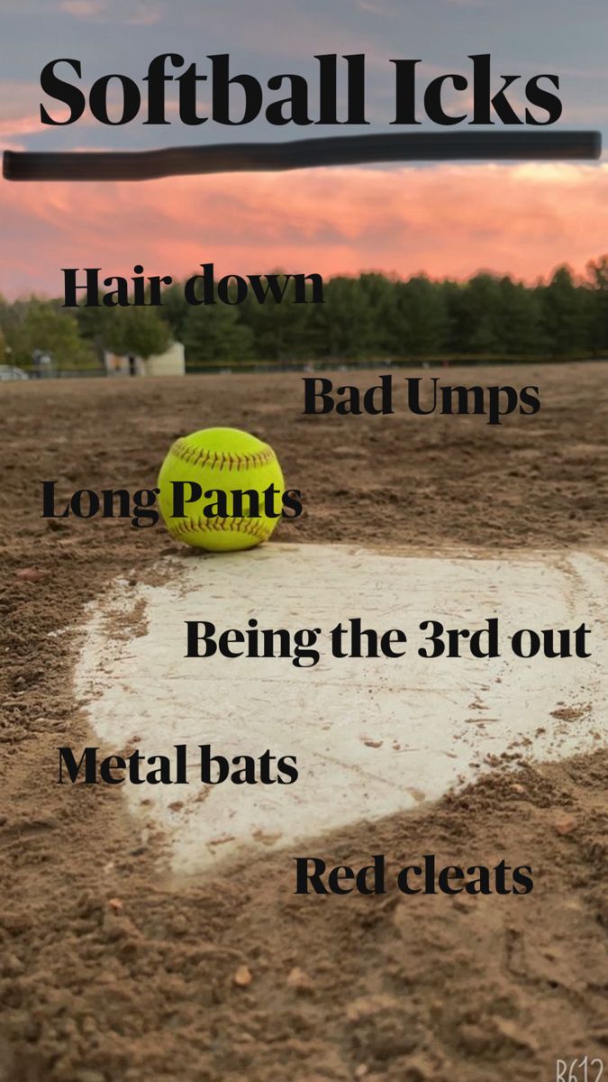 a softball sitting on top of a dirt field