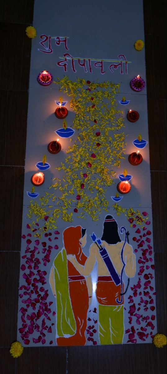 a decorated wall with candles and an image of two people holding hands in front of them