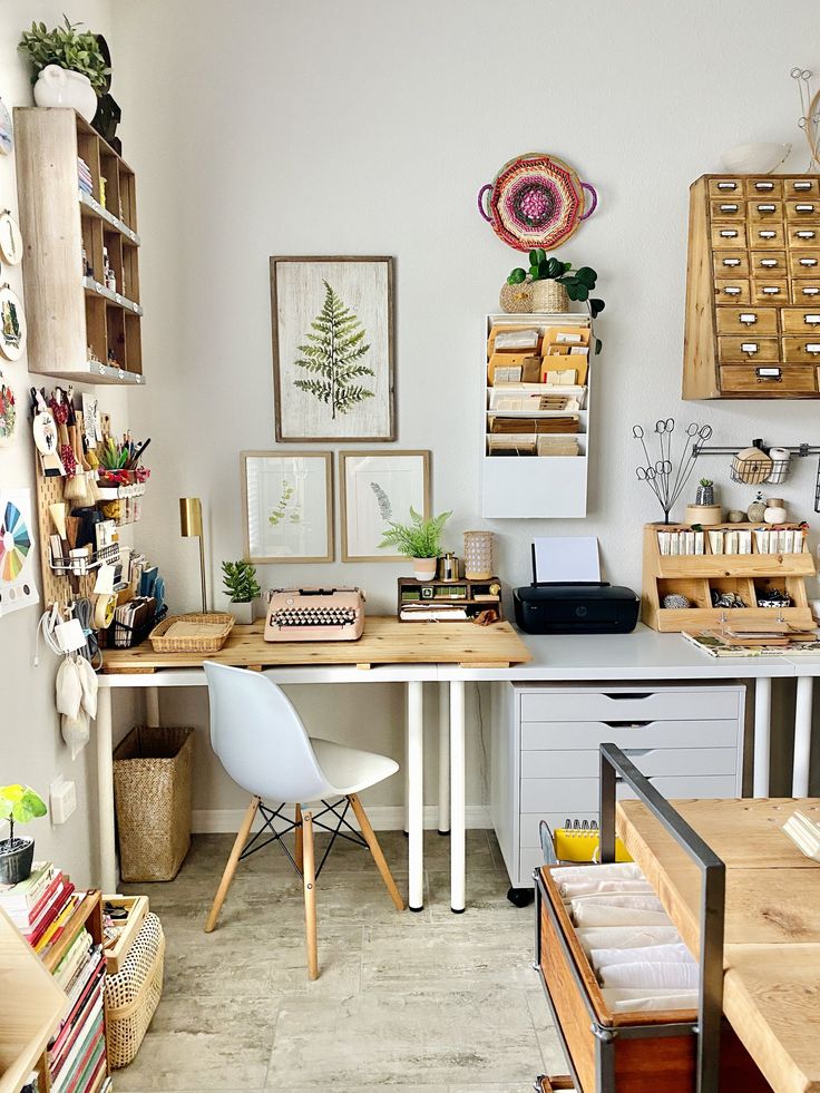 an office with lots of clutter on the desk and shelves in front of it