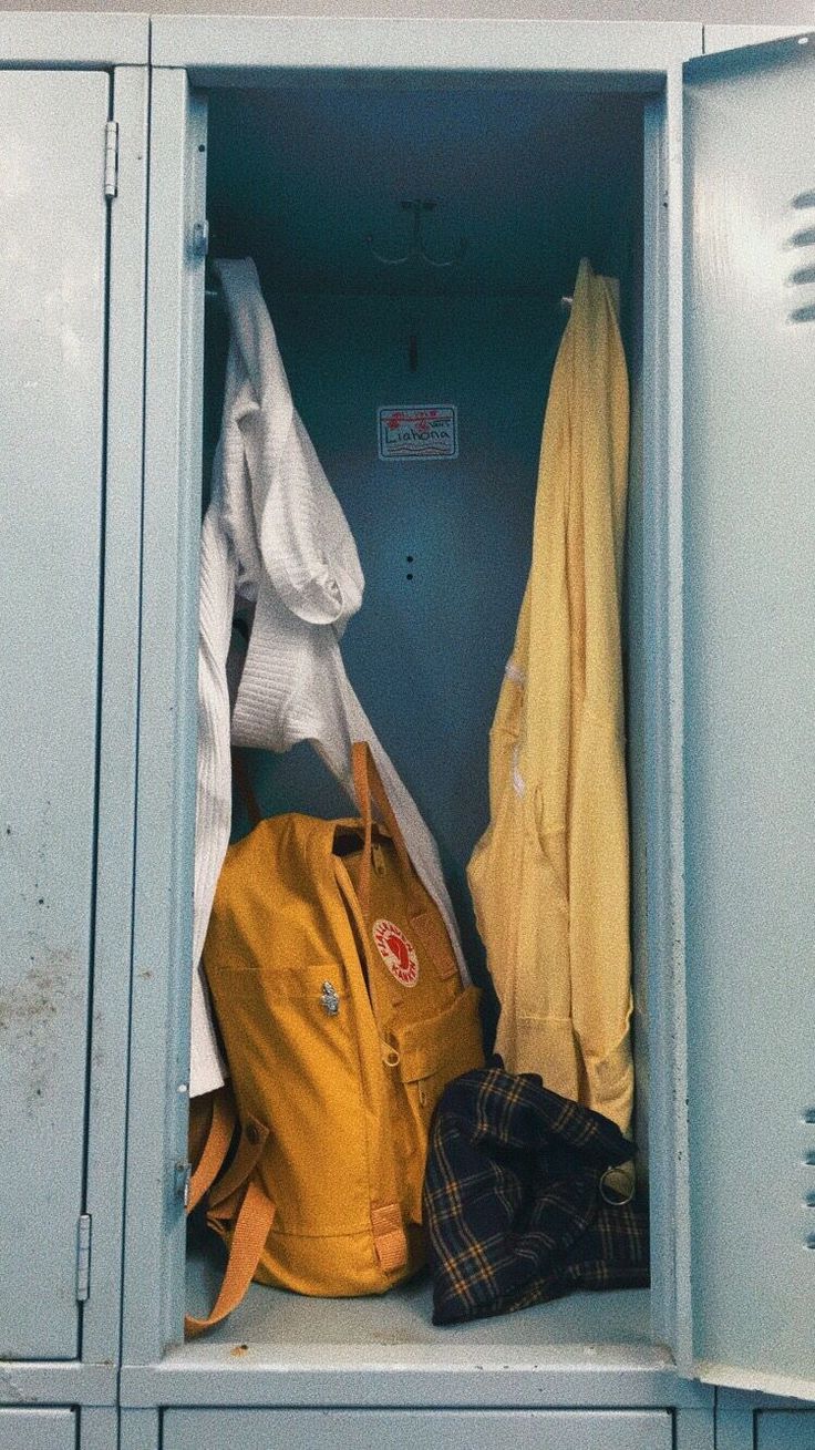 the lockers are filled with coats and hats