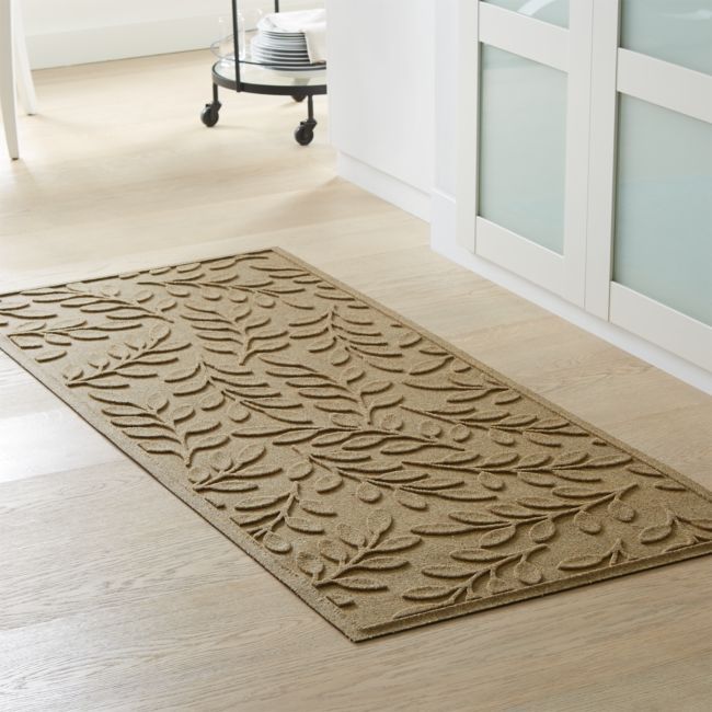 a bathroom rug with an intricate design on the floor