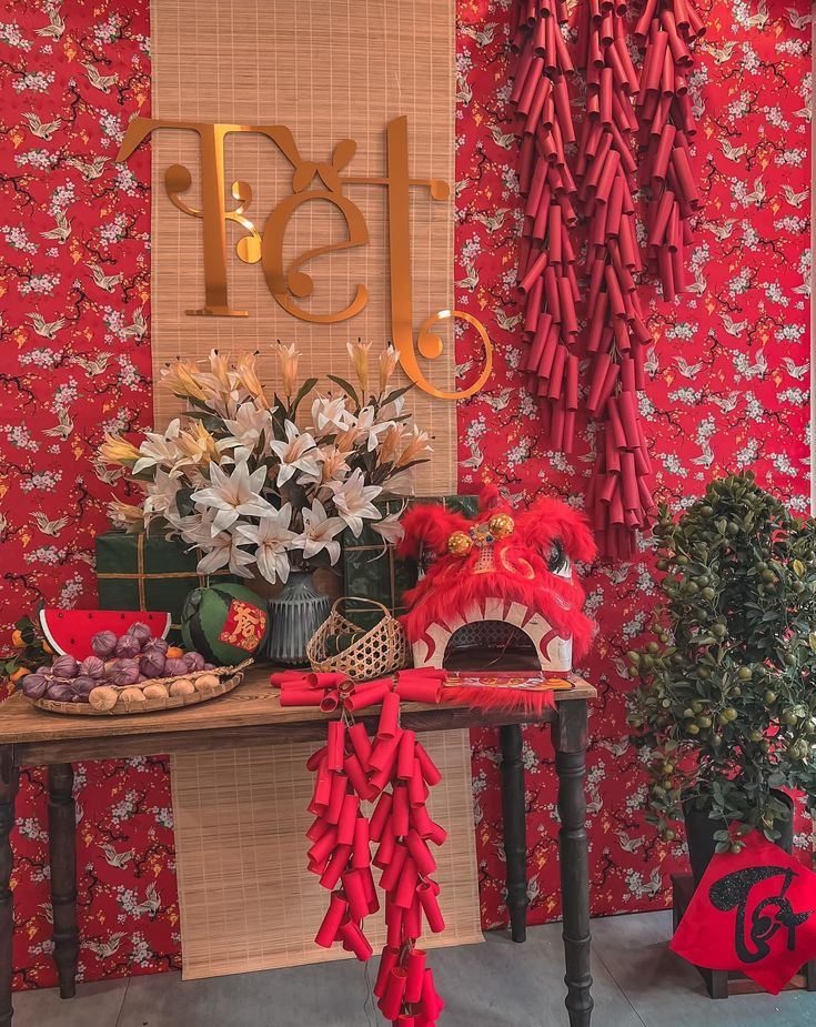 a red table topped with lots of decorations