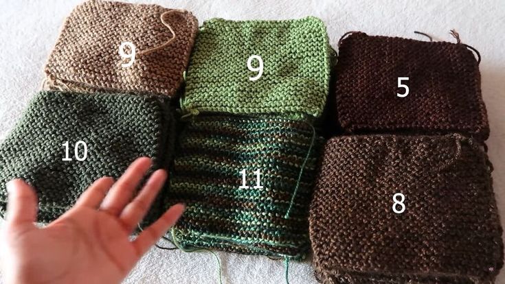 a hand is shown next to four different knitted items, with numbers on them