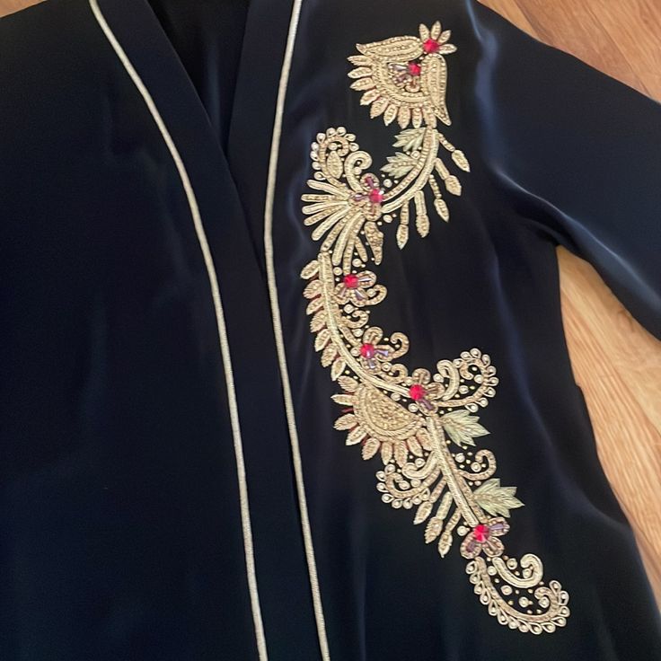 Women Abaya Worn Once Very Good Condition Beautiful Color And Material Size Large Formal Long Sleeve Silk Abaya, Elegant Embroidered Black Abaya, Traditional Long Sleeve Abaya For Evening, Traditional Long Sleeve Evening Abaya, Traditional Black V-neck Abaya, Elegant Black Embroidered Kaftan, Elegant V-neck Formal Abaya, Formal Black Kaftan With Dabka Embroidery, Elegant Embroidered Abaya For Festive Occasions