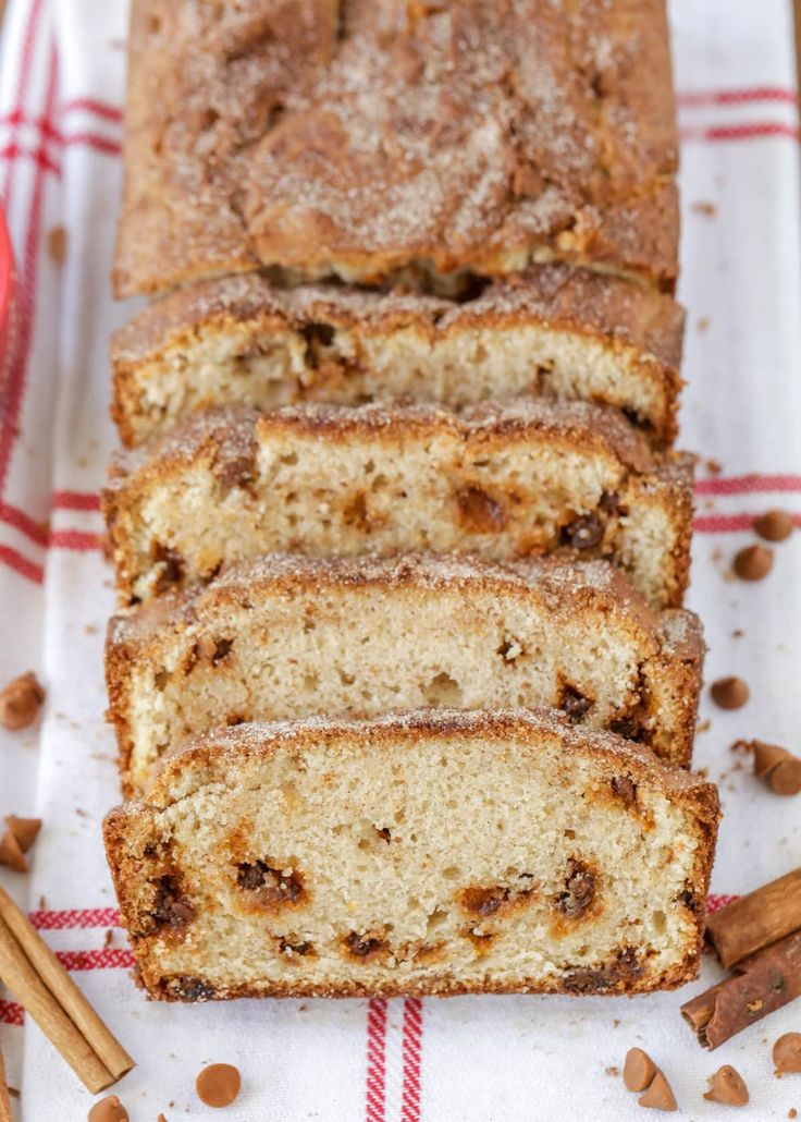 sliced loaf of cinnamon nut bread on a red and white checkered cloth