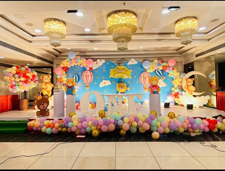 an entrance decorated with balloons and decorations for a children's birthday or baby shower