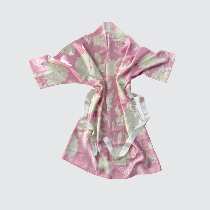 Luxury print kimono robe in pink silk with a cream floral design. Make waves in this kimono-inspired pink silk robe! Treat yourself to a luxurious look that's as sweet as a cherry blossom with its lush cream floral design. Slip it on for an instantly elevated look that'll have you feeling like royalty! Size: One size. Adult Woman Size. The robe comes in one size and will beautifully fit all sizes up to and including a UK 16. Loose wrapped construction for personal fit - One size. Length approxim Pink Silk Robe, Fashion Art Prints, Boho Inspiration, Silk Kimono Robe, Luxury Printing, Make Waves, Silk Robe, Accessories Brand, Print Kimonos