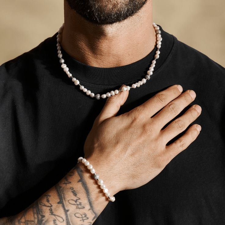 Once reserved for icons like ASAP Rocky and Travis Scott. Now, reserved for the Craftd Nation. Great for layering, yet bold enough to stand alone. Featuring signature iced spheres embellished in premium hand-set stones. ✓ 316L Stainless Steel & Rhodium✓ AAA Grade Cubic Zirconia✓ Water, Heat, Sweat Resistant✓ Hypoallergenic (No Green Skin) Included: 7" - 9" Adjustable FitIncluded: 5-7mm Freshwater pearls Everyday White Jewelry With Polished Beads, Everyday White Polished Beads Jewelry, Pearl White Round Beads Jewelry For Everyday, Everyday Jewelry With Polished Rondelle Beads, Everyday Rondelle Polished Bead Jewelry, Hand-strung Pearl Jewelry With Round Beads, Hand-strung Round Pearl Bead Jewelry, Pearl White Beaded Sterling Silver Jewelry, Spiritual Silver Beads Jewelry For Everyday