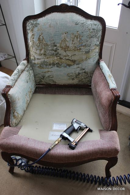 an old chair with hair dryers on top of it