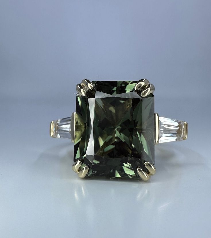 Wow picks! Radiant Cut Olive Green Sapphire Engagement Ring 14K White Gold Unique Vintage Olive Green Sapphire Engagement Rings Green Sapphire Ring at $695.00 Choose your wows. 🐕 #TravelRing #AnniversaryGift #EngagementRing #PromiseRing #ProposalRing #RectangleShape #WeddingRing #BirthdayGift #RadiantCut #LadiesRing Olive Green Engagement Ring, Engagement Rings Green, Rings Green, Sapphire Engagement Ring Set, Green Sapphire Engagement, Sapphire Engagement Rings, Green Sapphire Engagement Ring, Green Sapphire Ring, Green Stones