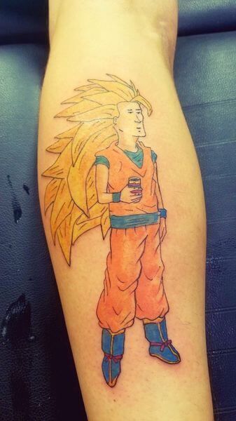 a person with a tattoo on their leg that has a drawing of gohan from dragon ball