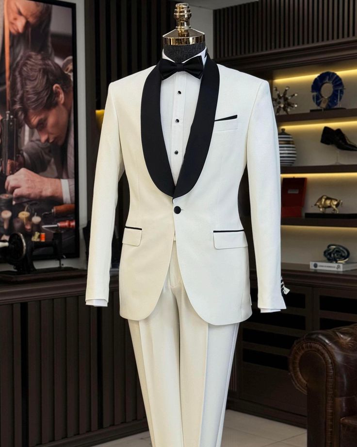 This men's white tuxedo suit is a must-have for any modern gentleman's formal wear collection. When you want to make a stylish entrance at your next event, this stunning slim-fit black blazer will help you do just that. Crafted from high-quality materials, this single-breasted tuxedo jacket is fully lined and features two exterior pockets. Perfect for formal occasions, this tuxedo ensures you look sharp and confident, offering great versatility and a flattering fit for your body. Remarks : Dry Clean Only Silk Satin Shawl collar Material: 65% Polyester, 32% Viscose, 3% Lycra Cutting: Single Button, Double Slits Package included : Jacket & Pants Mens Suit For Wedding, Slim Fit Groom Suit, Tuxedo Prom, Suit For Wedding, Groom Tuxedo, White Tuxedo, Groomsmen Suits, Bow Tie Wedding, Groom Wear