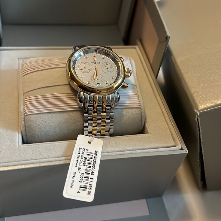 Brand New, Never Worn Michele Watch. Comes With Box (Has A Rip On One Of The Corners - See Picture) And The Storage Box Is Damaged. Got As A Gift, Beautiful Watch But Not My Style So I Never Wear It. Two-Toned. Battery Replaced 12/28/23 (5 Year Warranty, Receipt Available) Luxury Diamond Chronograph Watch For Formal Events, Designer Diamond Watch With Subdials For Anniversary, Round Diamond Chronograph Watch For Anniversary, Elegant Silver Diamond Chronograph Watch, Silver Chronograph Watch For Anniversary, Silver Round Chronograph Watch For Anniversary, Luxury Chronograph Watch For Anniversary, Designer Watches With Polished Finish For Anniversary, Classic White Gold Diamond Chronograph Watch