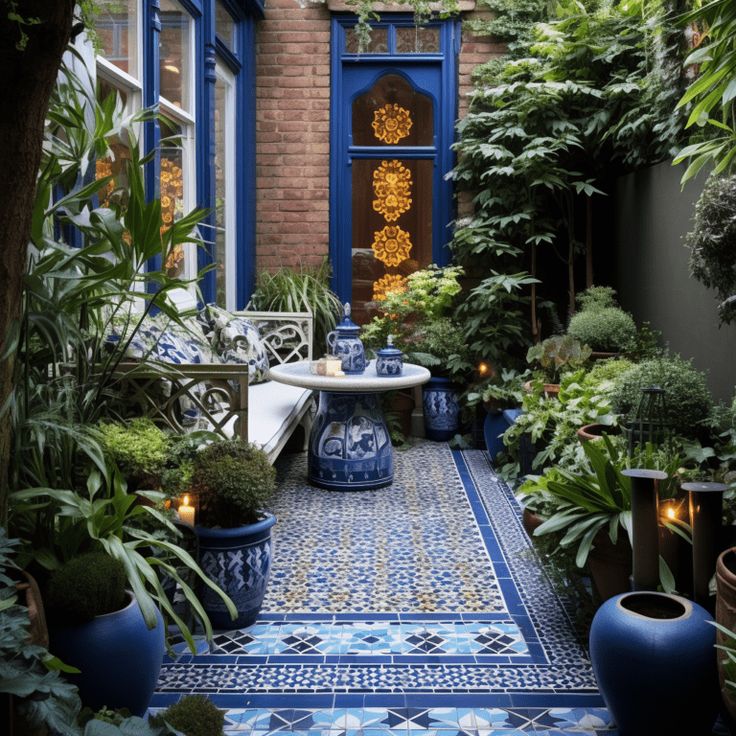 a blue and white tiled courtyard with potted plants