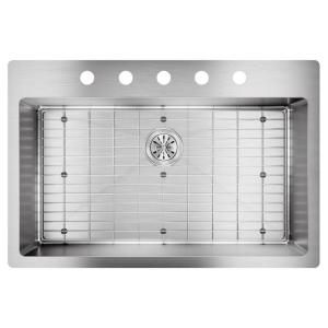 stainless steel kitchen sink with grids on the side and four holes in the front