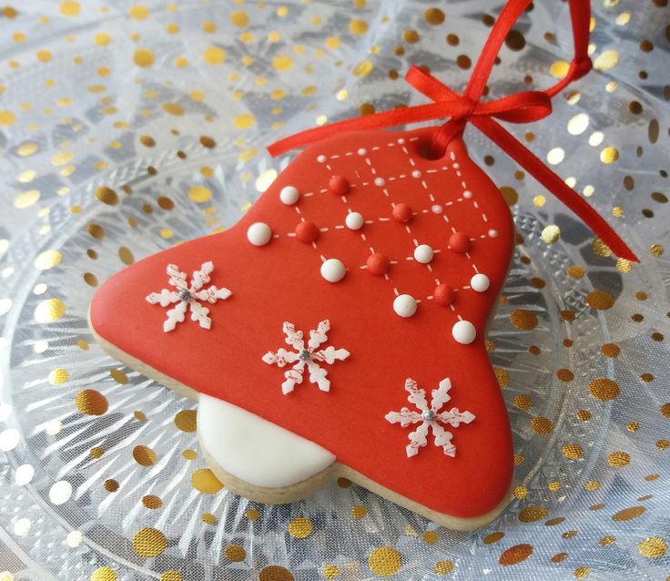 a decorated christmas cookie on a glass plate