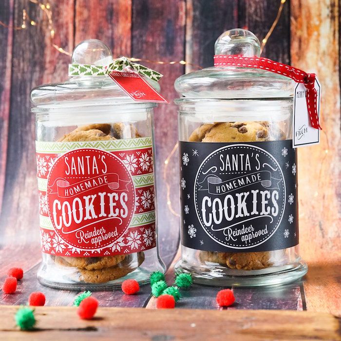 two glass jars filled with cookies and candy