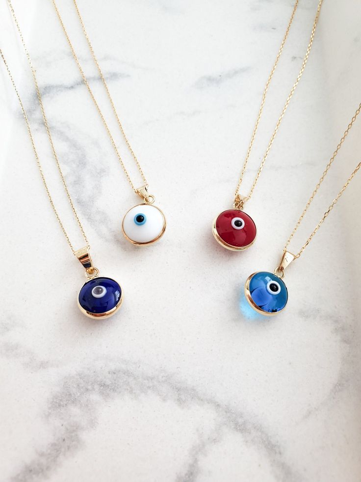 "14k Solid Gold Evil Eye Necklace - Protection Charm Pendant for Women - Light Blue, Dark Blue, Red, White Evil Eye Necklace - 18inch. The Yellow Gold Evil Eye Necklace \"Protection\" for Women is composed of high-quality 14 Karat Gold and glass/enamel. Evil Eye symbolizes fate protection and an open flow of communication. 🔳WARRANTY🔳 *6 Months warranty. *Free Shipping without price limit. *Easy Return and Replacement 30 days after purchase. Just contact me 😊 🔳EVIL EYE NECKLACE🔳 *Material: 1 Multicolor 14k Gold Necklace Gift, Handmade 14k Gold Blue Necklace, Handmade Blue 14k Gold Necklace, Blue 14k Gold Round Pendant Necklace, Blue Pendant Necklace In 14k Gold, Blue 14k Gold Pendant Necklace, Symbolic Evil Eye Round Pendant Necklace, Elegant Blue Necklace With Evil Eye Detail, Spiritual Blue Evil Eye Jewelry