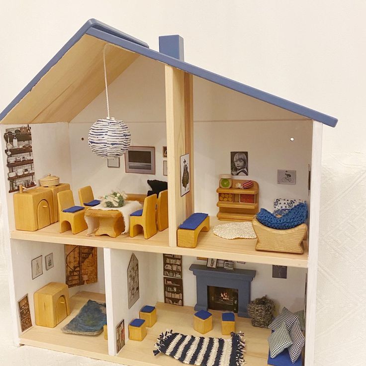 a doll house with furniture and accessories in it