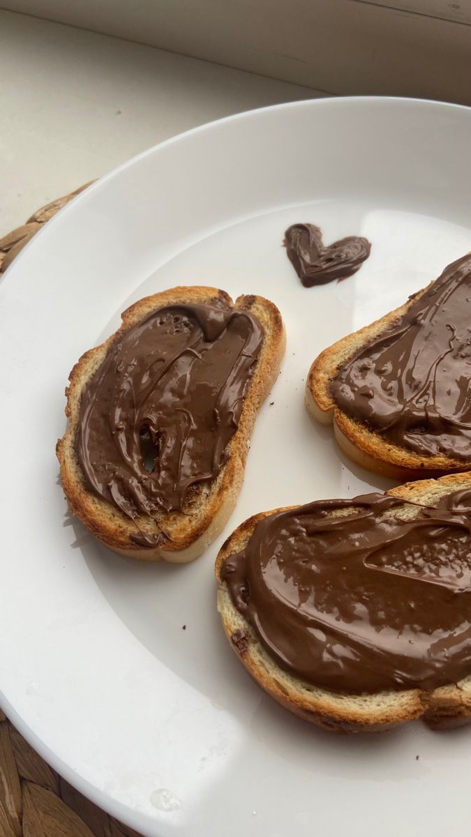 three pieces of bread with chocolate spread on them