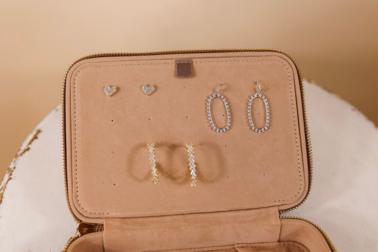 We’re making traveling a breeze with our timeless jewelry organizer! Store your necklaces, bracelets, earrings and rings in a perfect display fashion. This bag measures 8"x5.5"x2.5". SKU: Jewelry Organizer-Metallic Mocha Elegant Jewelry Storage For Travel, Everyday Elegant Brown Jewelry, Brown Elegant Everyday Jewelry, Elegant Brown Everyday Jewelry, Elegant Gold Jewelry Storage For Travel, Elegant Rectangular Jewelry Storage For Everyday Use, Elegant Rectangular Jewelry Storage, Luxury Brown Jewelry For Everyday Use, Chic Silver Jewelry For Everyday Use